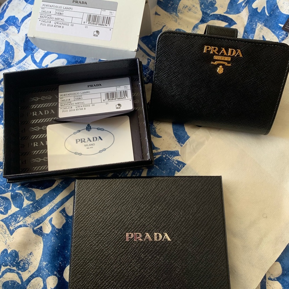 Prada Saffiano compact wallet.